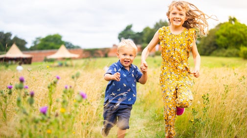 Children run through the Walled Garden at Ickworth Estate
